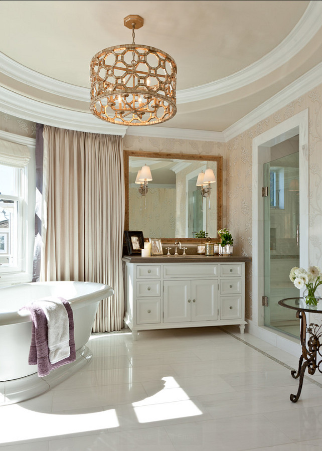 Bathroom. Master Bathroom Ideas. A marble-clad master bath that features custom cabinetry, a custom chandelier of crackle leaf finish over gilded metal and mother-of-pearl accents.