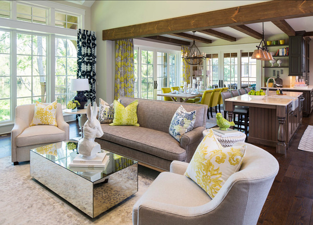 Colorful Interiors. Chic colorful interiors. The Baker chairs are covered in a Stark fabric. The sofa is by Lillian August. Paint Color is "Sherwin-Williams SW 6148 Wool Skein". #Interiors #FurnitureIdeas #ColorfulInteriors #InteriorPatternIdeas Designed by Martha O'Hara Interiors.