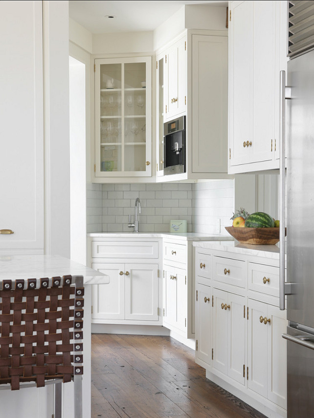 Kitchen Hardware. Kitchen with brass hardware. Kitchen Cabinet Hardware. The cabinets are shop painted with "Benjamin Moore 968 Dune White". The cabinets are shop painted with "Benjamin Moore 968 Dune White". Walls match in Matte finish. Hardware is from "Colonial Bronze". #Kitchen #KitchenHardware #KitchenCabinetHardware