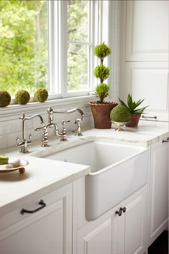 Kitchen Sink. Farmhouse sink. A beautifully integrated farmhouse sink is surrounded by immaculate white marble and flanked by integrated Dishwasher. #Kitchen #Sink