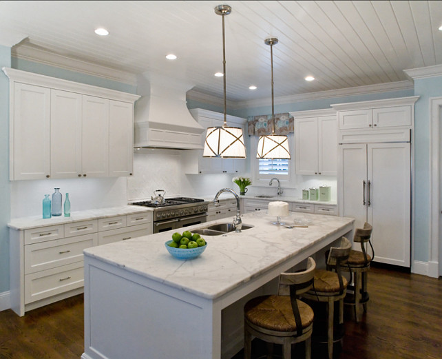 White Kitchen Design. White Kitchen with white marble countertop and turquoise decor. Studio M Interior Design, Inc.