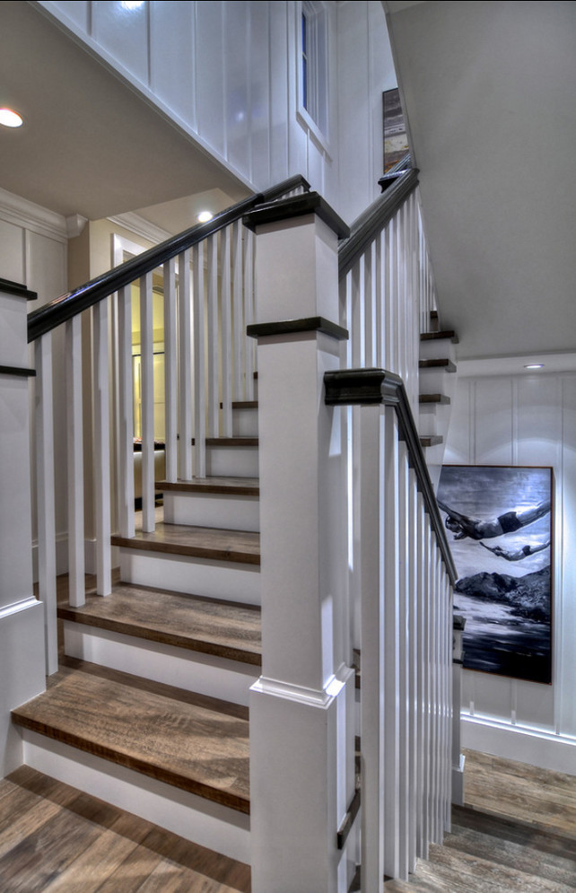 Stairway. Stairway Ideas. Detailed finished carpentry creates a wow factor on this square spiral stairway. White walls and spindles are compliments by wire brushed wood stairs and handrails. This stairway is truly a work of art. #Stairway