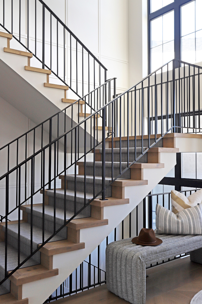 Steel matte black handrails steel matte black handrails The staircase notable for its generous width and size is complemented by smooth steel matte black handrails that add to the sleek modernity #Steelmatteblackhandrails #steelmattehandrails #blackhandrails #steelstaircase #blackhandrails #sleek #modern