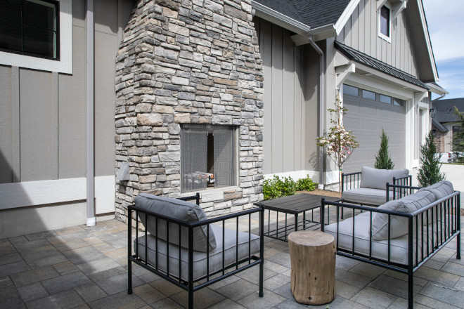 Courtyard Anchored by a stone outdoor fireplace this courtyard is a great way to take advantage to the space at the front of the house while adding to the curb appeal #courtyard