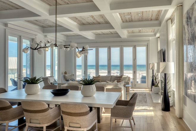 Florida Beach House Floor to ceiling French doors flood this great room with light bounced off the sugary sands of the Gulf of Mexico #Florida #BeachHouse #Floortoceiling #Frenchdoors #greatroom #light #GulfofMexico