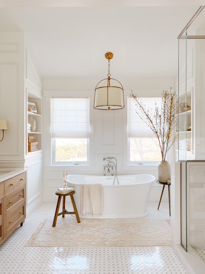 In this stunning bathroom renovation a classic freestanding tub is flanked by beautiful millwork with built-ins In this stunning bathroom renovation a classic freestanding tub is flanked by beautiful millwork with built-ins #stunningbathroom #bathroom #renovation #bathroomrenovation #freestandingtub #millwork #builtins