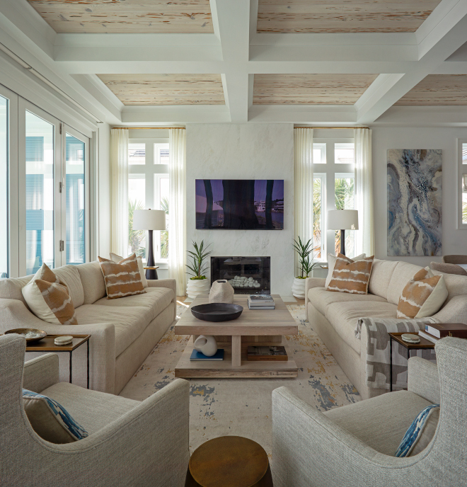 Living room A marble fireplace accentuates the high coffered ceilings with Pecky Cypress wood inlays #Livingroom #marblefireplace #cofferedceilings #PeckyCypress #woodinlays