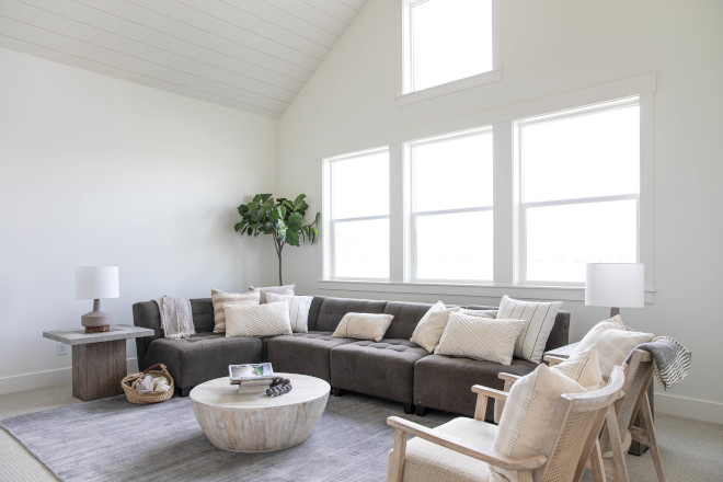 The bonus room features valuted shiplap ceilings with boxed beam and plenty of space to curl-up at the end of the day #bonusroom #bonusroomdesign #bonusroomideas
