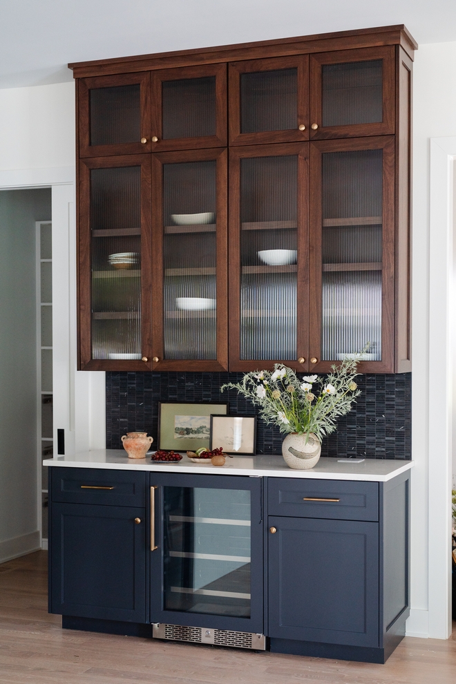 Upper Cabinet Walnut Peppercorn stain with reeded glass doors Lower Cabinet Paint Color Sherwin Williams Cyberspace