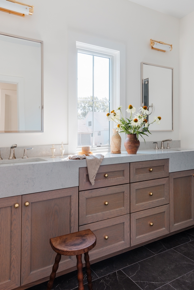 The custom white oak vanity is accentuated with custom apron sinks made out of the same material used on the countertop #bathroomideas #bathroom #ideas