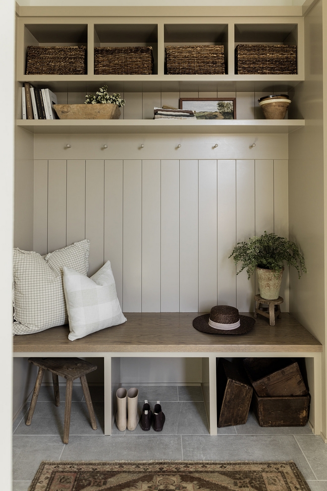 The natural wood tones harmonized beautifully this mudroom crafting a warm and inviting atmosphere that encouraged both family and guests to linger and feel at home. A small potted plant introduced a splash of greenery infusing the cozy space with life and vibrancy #mudroom