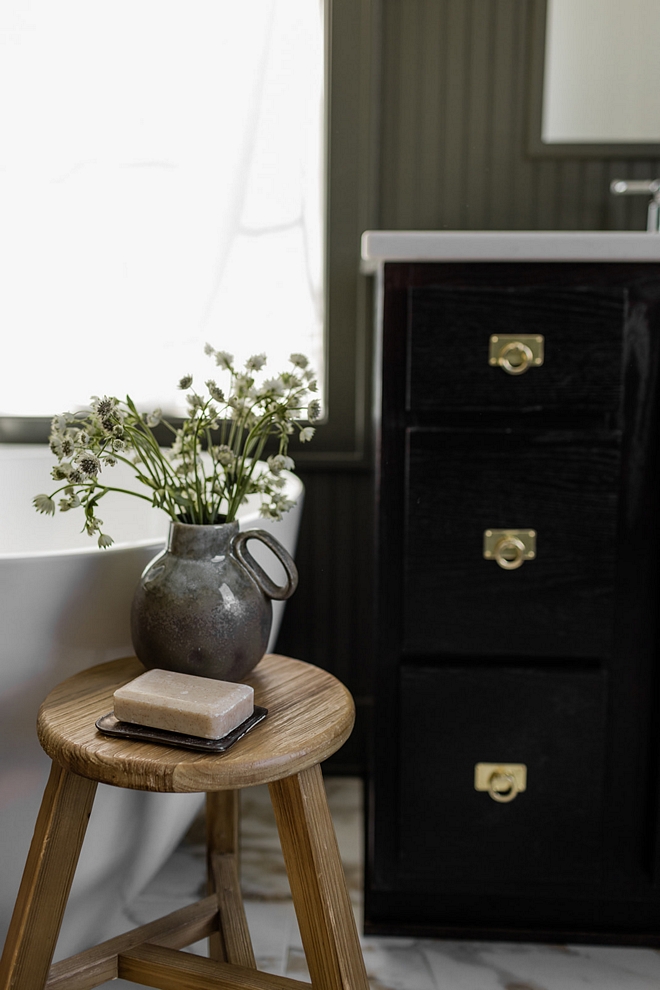 An earthy bathroom establishes a warm and tranquil ambiance by integrating natural colors and textures