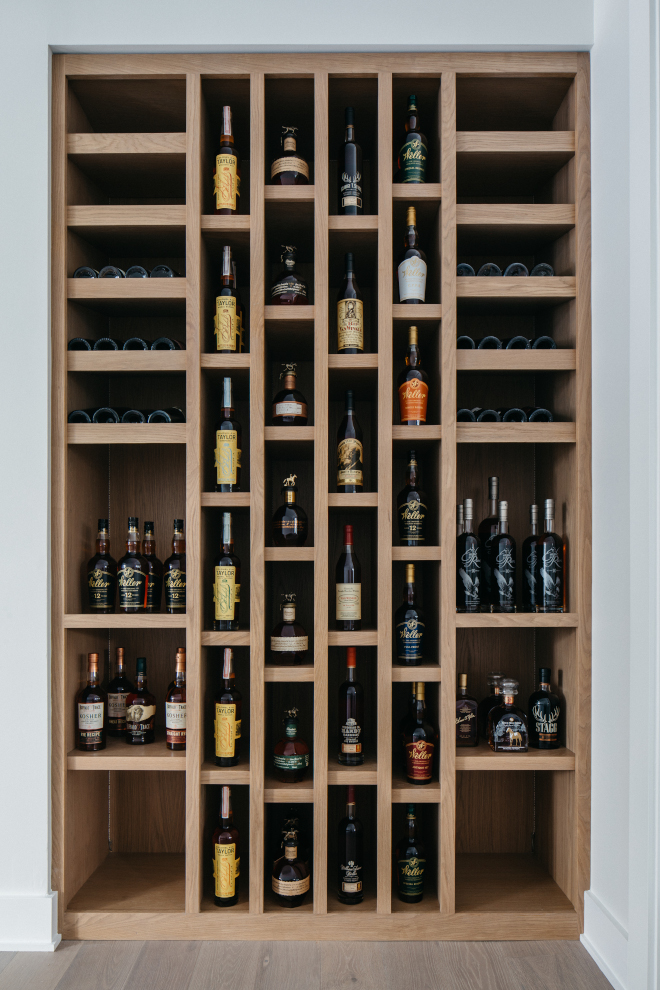 Foyer closet was converted into a built-in perfect to display the homeowners wine collection #Foyer #closet #converted #builtin #bookcase #display #wine