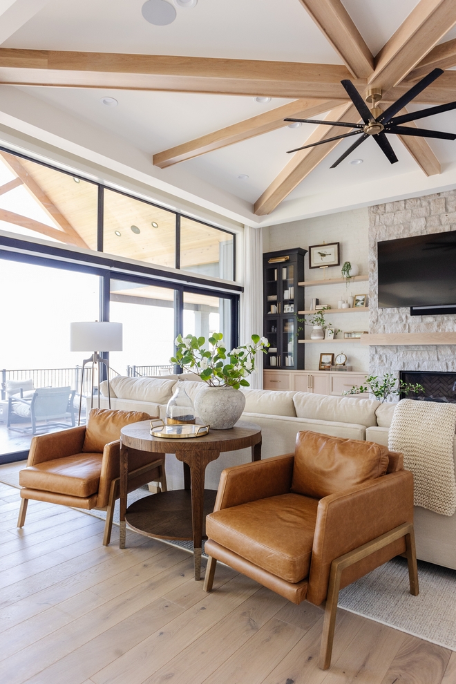 Leather chair By incorporating a pair of accent chairs behind the large sectional the designer successfully established multiple seating areas #leatherchair #accentchair #furniture