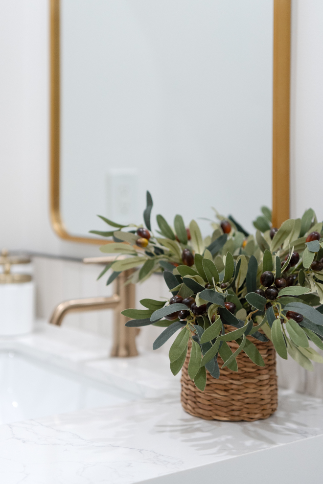 Incorporating either real or artificial plants brings a refreshing touch to a bathroom