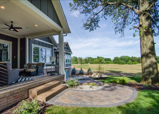 Backyard. Backyard with beautiful landscaping and porch. #Backyard #BackyardIdeas #BackyardDesign #Landscaping #Porch #PatioFurniture