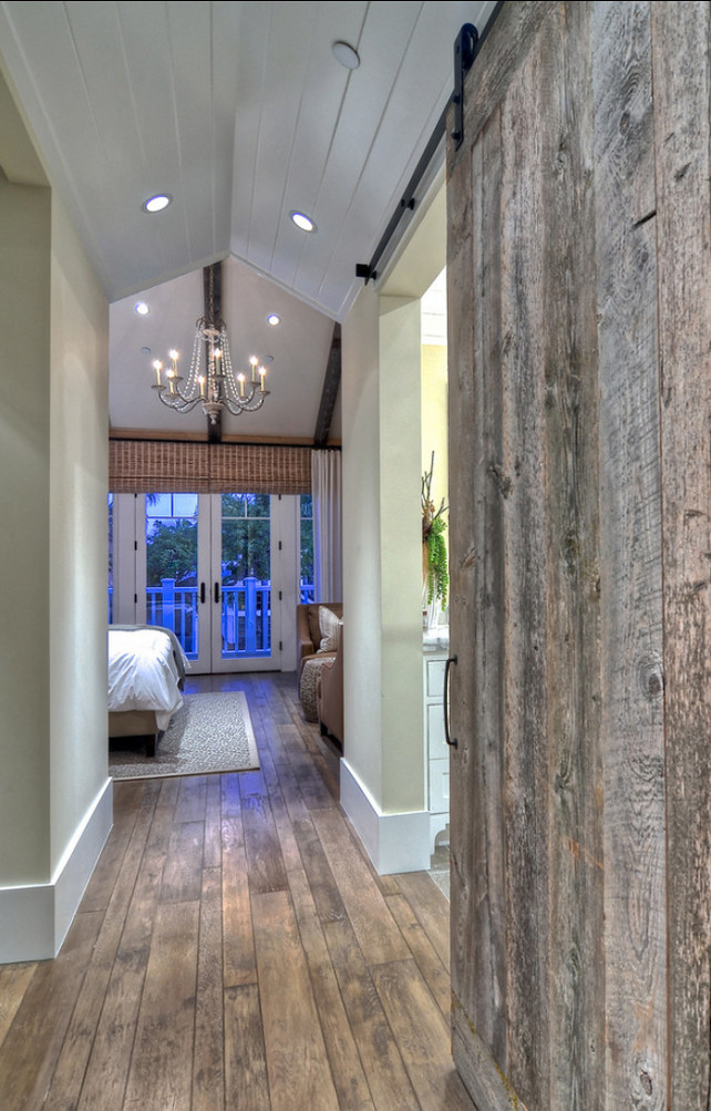 Barn Door Ideas. Sliding reclaimed wood barn doors allow an open feel the hallway as well as privacy when needed. #BarnDoor