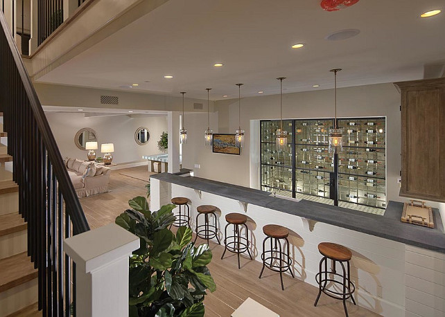 Basement. Basement Ideas Basement Design. This basement has a bar with built-in wine room. #Basement #BasementIdeas #BasementDesign #Wineroom