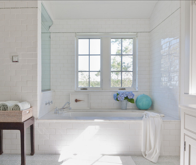 Bathroom. Bathroom with white subway tiles, bathtub with marble slab and Calacatta marble flooring. #Bathroom #BathroomIdeas Wettling Architects.