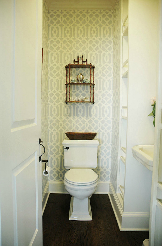 Bathrooom Ideas. Zen bathroom with Kelly Wearstler Imperial Trellis Soft Aqua Wallpaper and chinoiserie bamboo wall shelf. Chocolate stained wood bathroom floors and white pedestal sink flanked by built-in cabinets. Morrison Fair