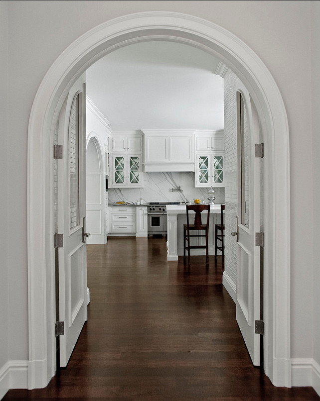 Caden Design Group. Kitchen Ideas. Custom doors that take shape of the arch create a beautiful entrance into a pristine kitchen. #Kitchen