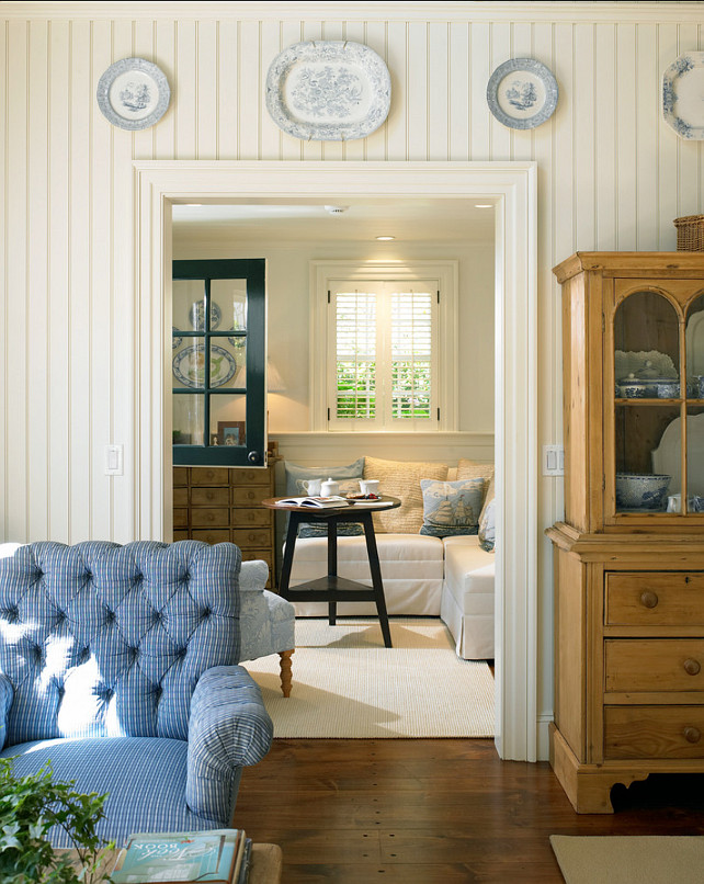 Coastal Living Room. Coastal living room with classic decor and beadboard wall panelling. #Livingroom #CoastalInteriors #Coastaldecor #Classicinteriors