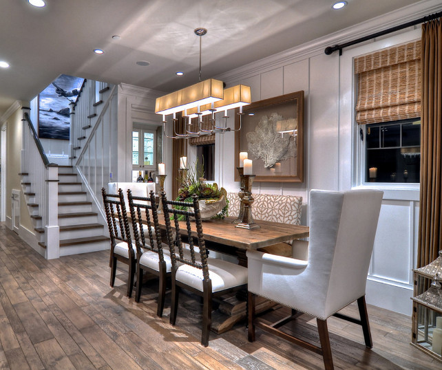 Dining Room.Coastal Dining Room Design. A mix of eclectic chairs and an upholstered bench surround a rectangular dining table in this warm and open formal dining room. #DiningRoom #CoastalDiningRoom #DiningRoomIdeas #DiningRoomDesign 