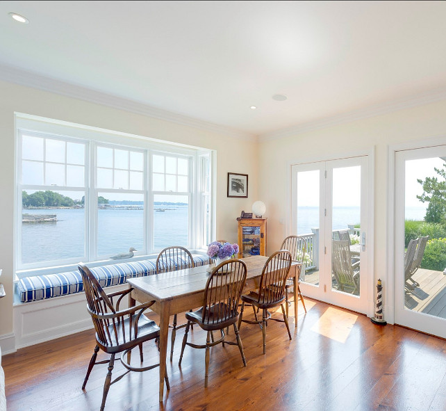 Eating Nook. Eating nook with coastal decor. Take a look at the amazing ocean view this eating nook have! Similar Paint Color: Benjamin Moore "Mannequin Cream" OC-92  #EatingNook #EatingNookIdeas #EatingnNookDesign Vias Sotheby's Homes.