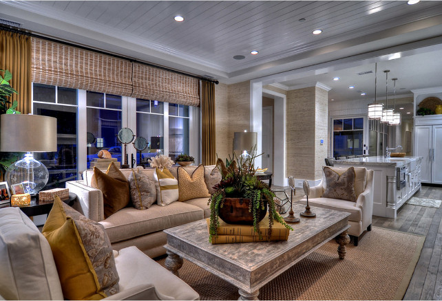 Family Room Design Ideas. Wire brushed wood floors are accented by a sea grass area rug in this family room. #FamilyRoom #FamilyRoomDesign #FamilyRoomDecor