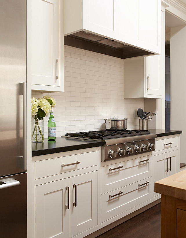 Kitchen Backsplash. White Ceramic Subway tiles. The backsplash in this kitchen is white ceramic subway tiles. #Backsplash #CeramicSubwayTiles #WhiteSubwayTilesBacksplash Backsplash is "Blue Slide Art tile". They are 2" x 6". Rasmussen Construction.