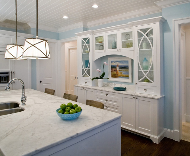 Kitchen Cabinet Ideas. That Hutch measures approximately 8'-0" wide by 2'-0" deep and is semi-recessed into the wall. Lighting Pendants are the "Grosvenor One-Light Downlight" by Circa Lighting. Cabinet Paint Color is "Benjamin Moore PM-1 Super White". Studio M Interior Design, Inc. #BenjaminMoore #PM1 #SuperWhite