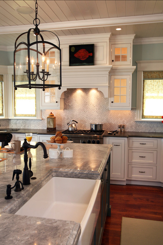 Kitchen Ideas. Inspiring kitchen design ideas. Kitchen countertops are Soapstone in 1.25 thick material, island is Carrera 2 thick marble; both with “Ogee edge treatment. The island is 156 x 56. Light fixture is the Arch Top Lantern from Visual Comfort. #Kitchen #KItchenIdeas #CountertopMaterial Asher Associates Architects.