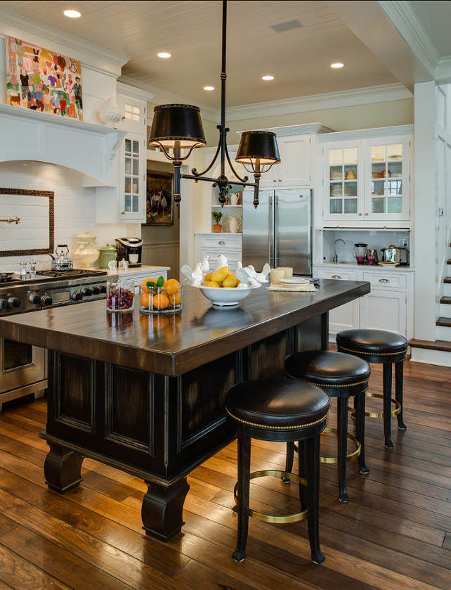 Kitchen Island. Kitchen Island Design Ideas. Pendant Lighting above this kitchen island is the SLOANE STREET DOUBLE BILLIARD LIGHT from Circa Lighting. This island is truly inspire. I love the unique feet and the lighting under it. The island is stained in Antique Walnut and it measures 9 feet. #KitchenIsland #Ktchen #PendantLighting