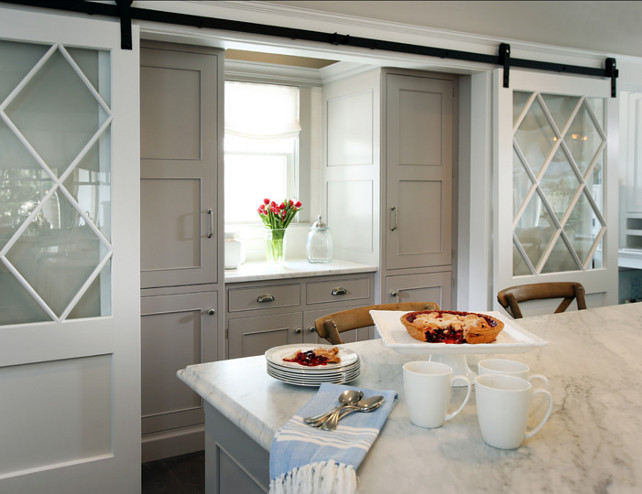 Kitchen Pantry Ideas. This kitchen features an elegant kitchen pantry with custom cabinets and double barn doors. #Kitchen #KitchenPantry #Pantry #Butlerspantry #BarnDoor