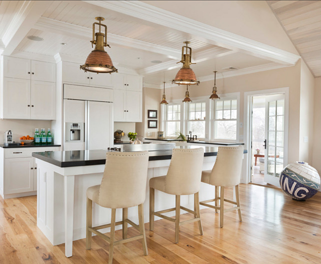 Kitchen. Kitchen Ideas. White kitchen with coastal decor. Light fixture pendants are salvage ship lights #Kitchen #KitchenLighting #Lighting #Pendants #IslandPendants#Kitchen #CoastalKitchen #KitchenIdeas