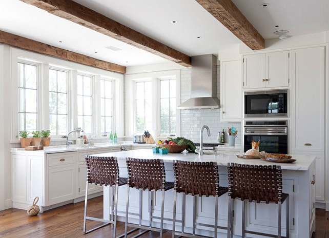 Kitchen. Transitional Kitchen with white cabinets, hardwood floors, marble countertop and white subway tile backsplash. #Kitchen #WhiteKitchen