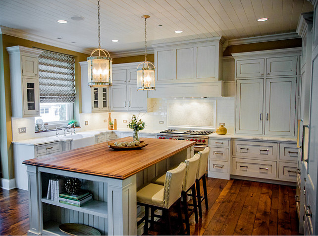 Kitchen. White Kitchen. Transitional White Kitchen with white marble countertop and large kitchen island. The counter stools are from Sunpan Imports. #Kitchen #WhiteKItchen #TransitionalKitchen #KitchenIdeas #KitchenDesign