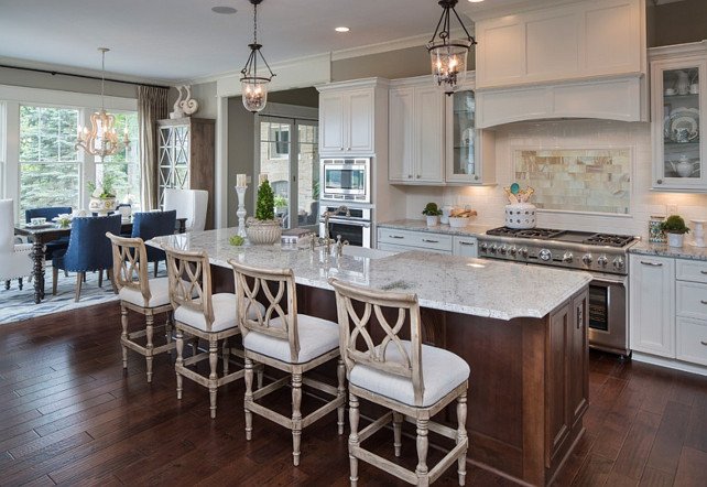 Kitchen. White kitchen with open floor plan. The island counterstools are from "Ballard Designs". They are the "Montgomery Counterstool" in the aged driftwood oak and linen finish. Kitchen with Granite Countertop: The granite color in this kitchen is called "Cotton White". WhiteKitchen #OpenFloorplanKitchen