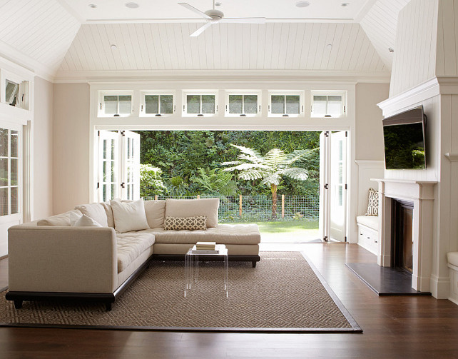 Living Room Ideas. Simple, clean, light-filled living room. Living Room Furniture. Living Room with section and jute rug. #LivingRoom The Ceiling and Trim Color is: "Benjamin Moore White Dove OC-17". Rasmussen Construction.