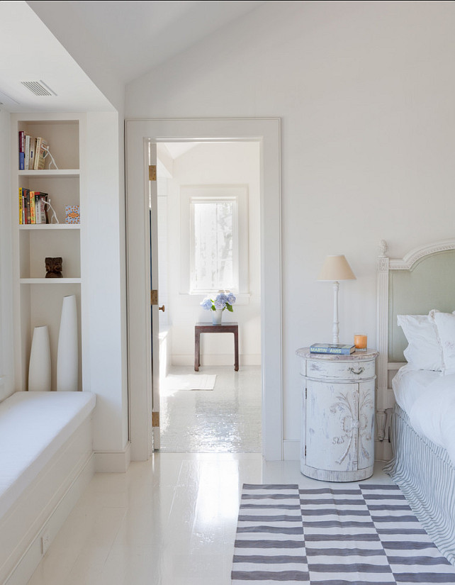 Painted Hardwood Floors. Bedroom with white painted hardwood floor. The ceilings and walls are Benjamin Moore 967 (cloud white) and the trim is Benjamin Moore 968 (dune white). #PaintedFloors #PaintedHardwoodFloor