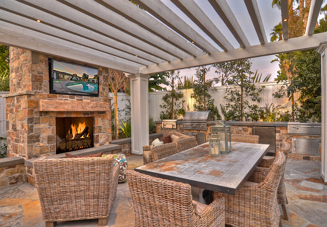 Pergola. Pergola with outdoor fireplace, outdoor furniture and TV. #pergola #OutdoorSpaces #PatioDecoratingIdeas