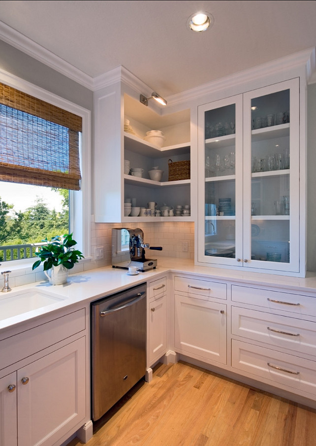 Kitchen Cabinet. The cabinet in this kitchen is open and reminds you of open shelves. Changing this look is easy. You just need to install the cabinet doors back. #Kitchen #Cabinet #KitchenCabinet