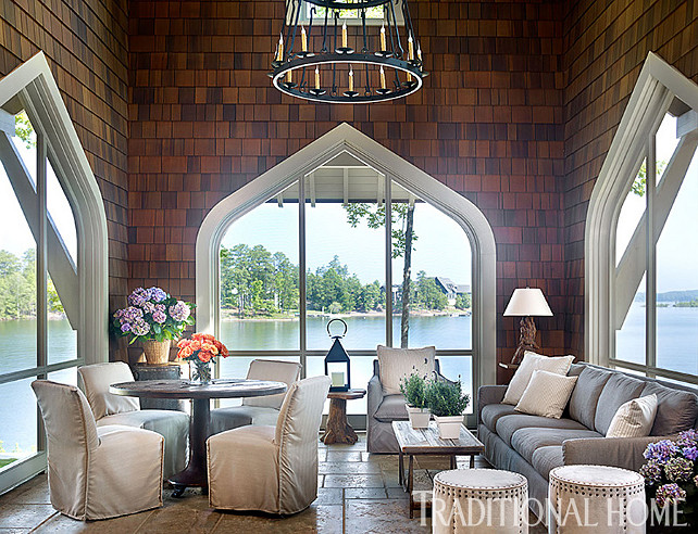 Sunroom. Rustic Designed Sunroom. The dining chairs in the sunroom are from Lee Industries are covered in a weather-resistant fabric. #Sunroom #ScreenedPatio