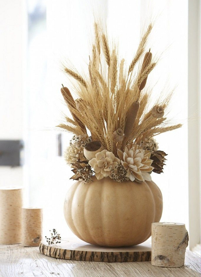 Thanksgiving Arrangement. Use faux pumpkins to create a long lasting and affordable thanksgiving centerpiece arrangement. Via The Daily Basics.
