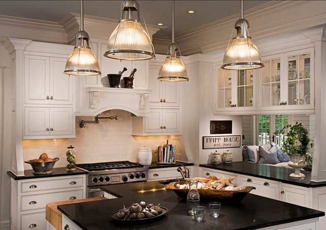 White Kitchen. White Kitchen design with "honed absolute black granite". This is a very classic take on white kitchen design. #WhiteKitchen #KItchenDesign #BlackGranite