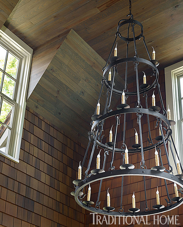Wrought Iron Chandelier. Wrought Iron Chandelier Ideas. The gracious three-tiered Wrought Iron Chandelier is from Laura Lee Designs. It adds rustic elegance to the sunroom. #Chandelier. #WroughtIronChandelier